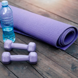 A graphic of a workout mat with a water bottle and light weights promoting a Remote Therapeutic Monitoring program. 