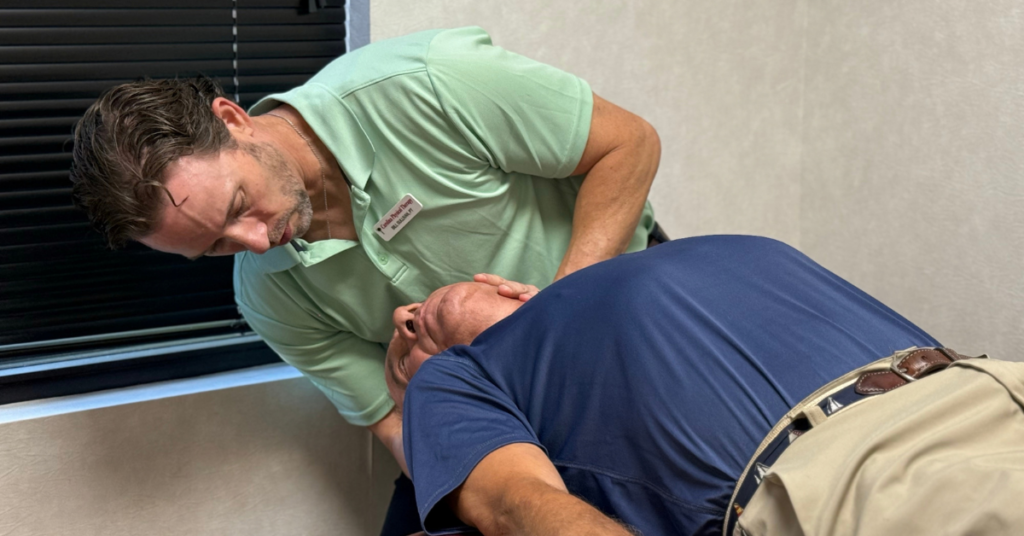Bill Sullivan, PT, Cert. SMT, MCMT treating a vertigo patient with vestibular therapy at Carolina Physical Therapy in Lexington, SC.