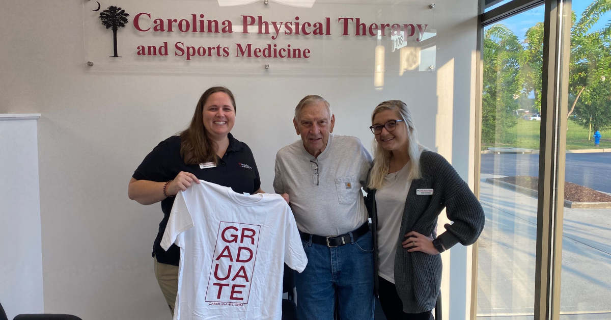 Patient receiving care at Carolina Physical Therapy in Gilbert, SC, posing with PTA (Physical Therapy Assistant) and Clinic Director Christen Bunnells and Rebecca.
